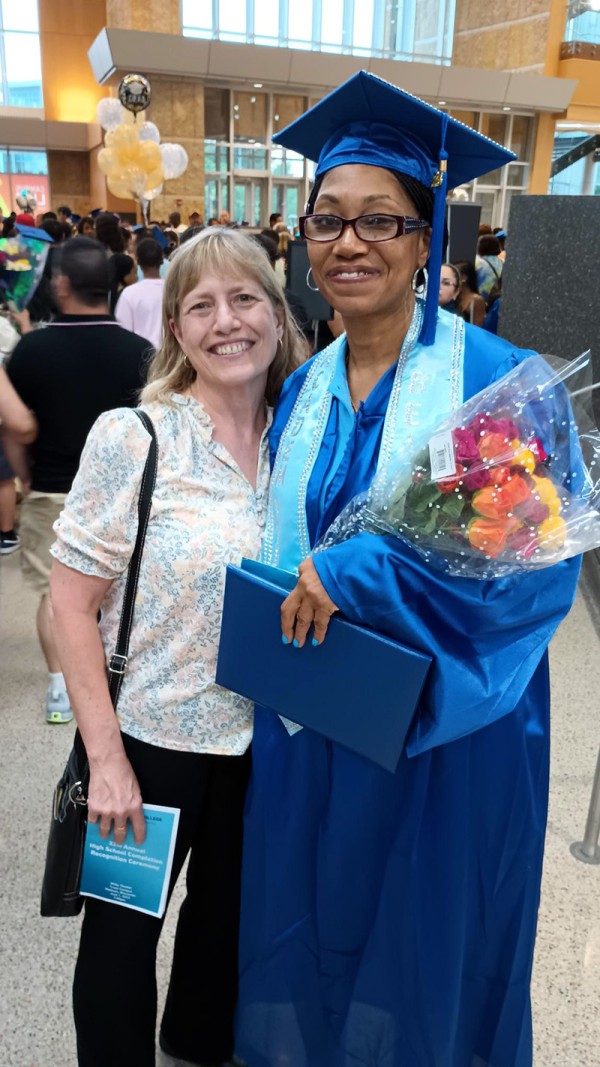 Two happy women at at graduation ceremony.