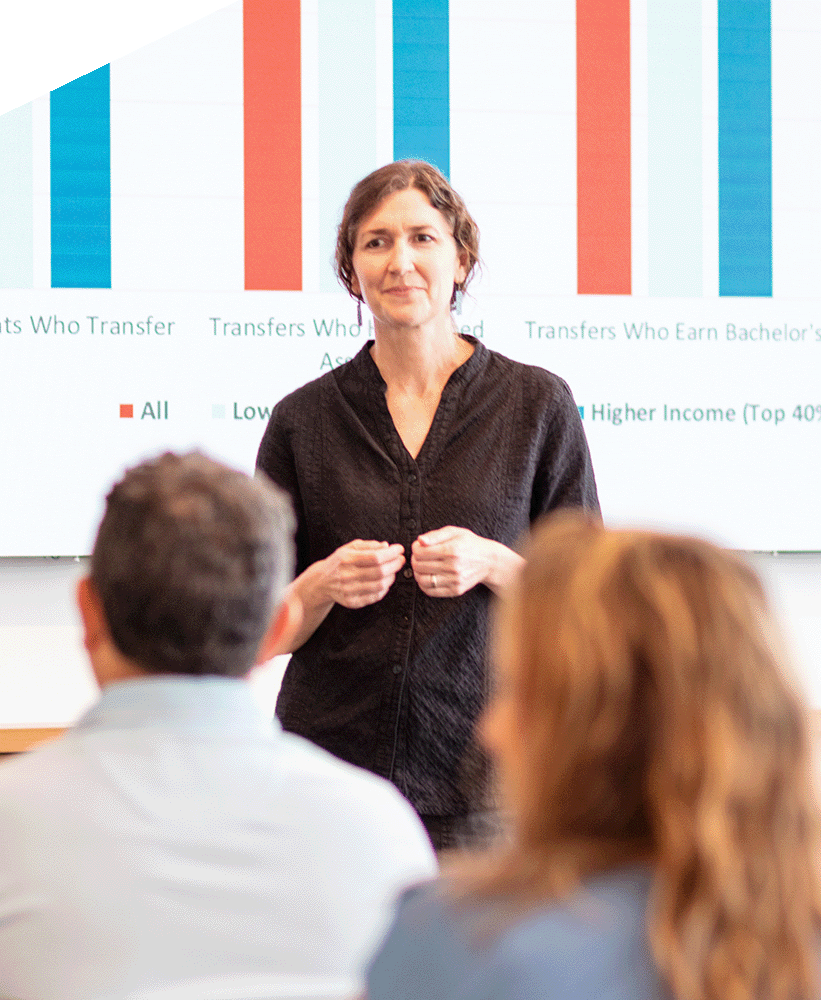 An Ascendium employee presenting in front of an audience. 