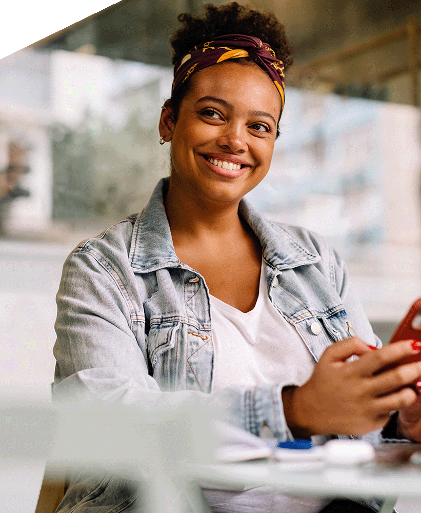 Smiling person on their phone. 