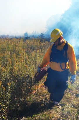 Mitch working in a field.